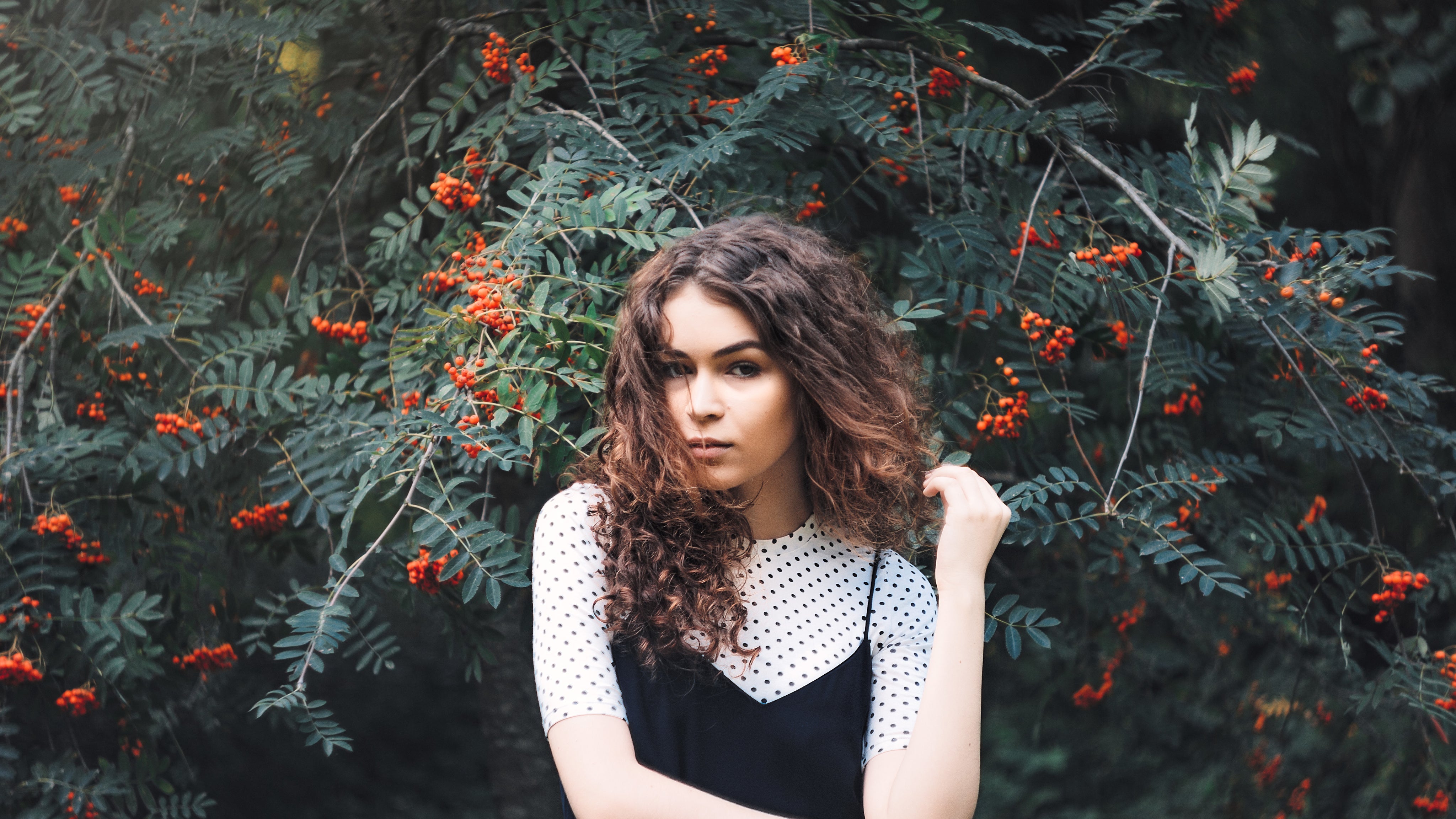 files/woman-infront-of-tree-with-berries.jpg